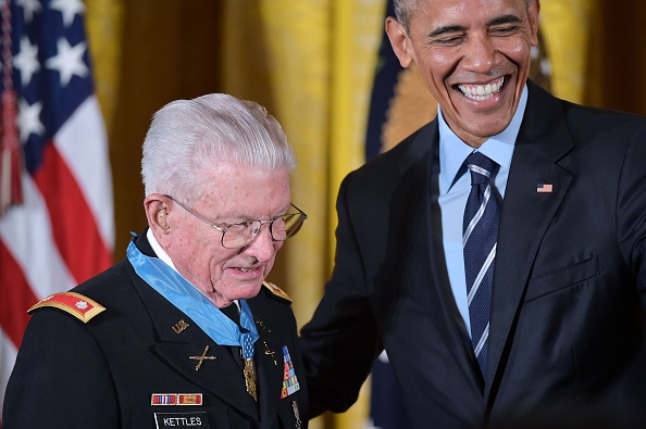 US President Barack Obama stands with retired US Army Lt. Colonel Charles Kettles after presenting him with the Medal of Homor during a ceremony in the East Room of the White House on July 18, 2016 in Washington, DC. Lt. Colonel Kettles was awarded the Medal of Honor for conspicuous gallantry while serving in Vietnam. / AFP / MANDEL NGAN (Photo credit should read MANDEL NGAN/AFP/Getty Images)