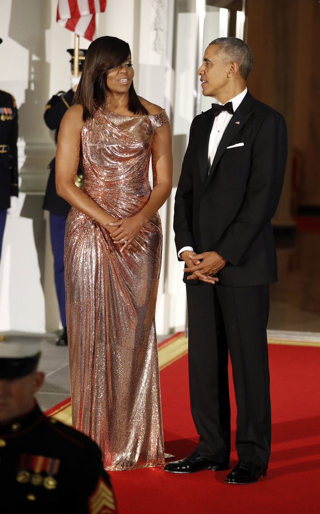 President Barack Obama and first lady Michelle Obama wait to greet Italian Prime Minister Matteo Renzi and his wife Agnese Landini on the North Portico for a State Dinner at the White House in Washington, Tuesday, Oct. 18, 2016. (AP Photo/Pablo Martinez Monsivais)