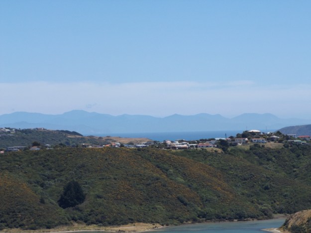 The view across Onepoto to the hills of the South Island looking blue in the heat haze.
