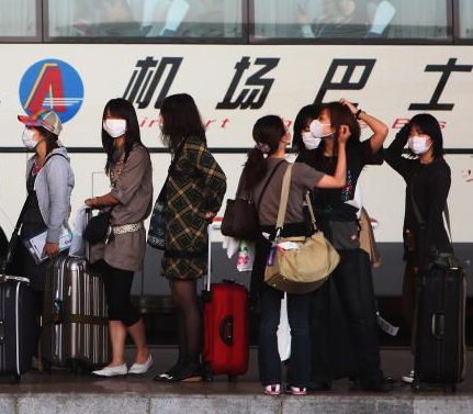 People in face masks in China during the flu epidemic People in face masks in China during the flu epidemic