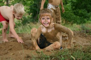 kids playing in the mud