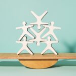 A composition of wooden human figures stacked in balance. - SciELO in Perspective | Press Releases A composition of wooden human figures stacked in balance.