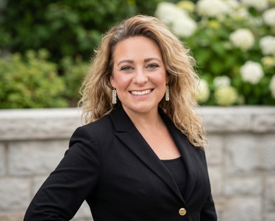 Professional AI headshot example created by HeadshotPro - female business portrait