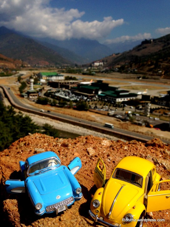 Paro international airport is located in a deep valley at an elevation of 7300 ft above sea level. The surrounding hills are high as 16,000 ft.