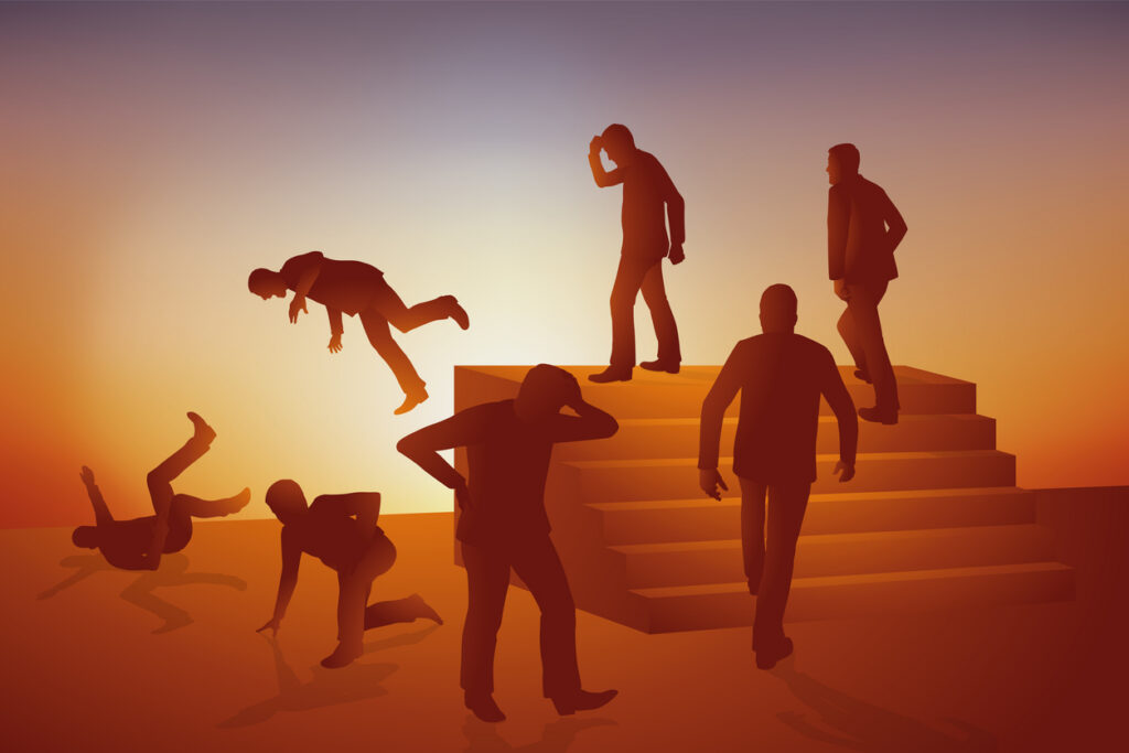 concept of the vicious circle, as a silhouette of a man climbs a set of stairs, falls, then repeats the same pattern