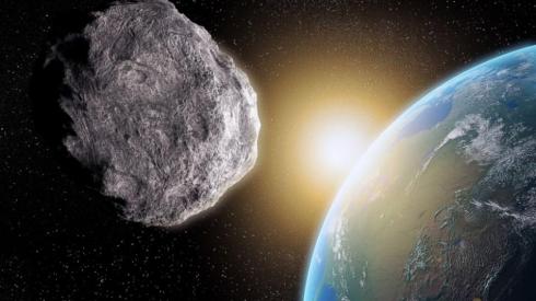 "Photo by: NASA ... An astroid zooming by planet Earth October 31, 2015."