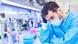 Scientist wearing a mask while working in a laboratory Scientist wearing a mask while working in a laboratory
