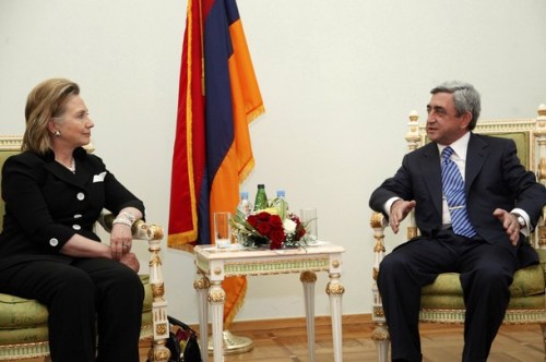 US Secretary of State Clinton listens to Armenian President Sargsyan during their meeting in Yerevan