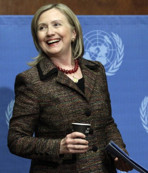 US Secretary of State Clinton smiles at the end of a news conference after her speech at the United Nations Human Rights Council in Geneva