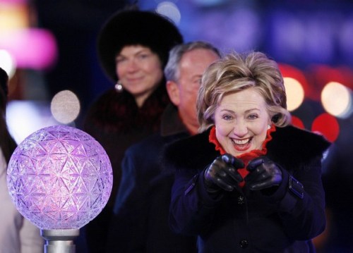 U.S. Senator Clinton reacts to the crowd in Times Square before pushing the button to lower the crystal ball during New Year festivities in New York
