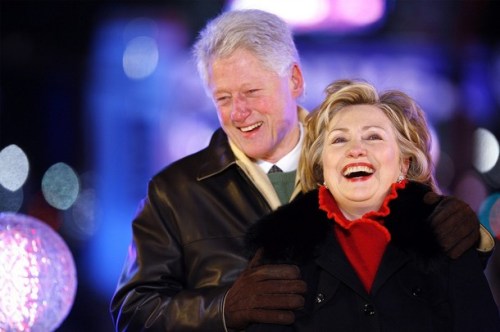 Bill and Hillary Clinton celebrate at midnight in Times Square after pushing the button to lower the crystal ball during New Year festivities in New York