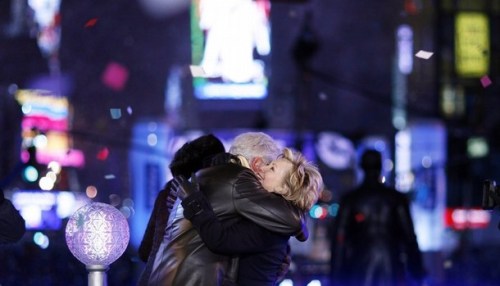 Bill and Hillary Clinton embrace at midnight in Times Square after pushing the button to lower the crystal ball during New Year festivities in New York