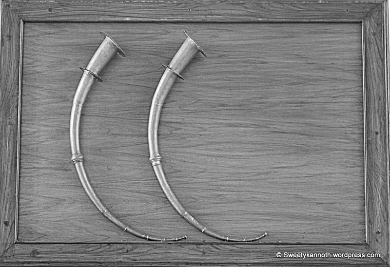 'Kombu' , a musical instrument , is a large curved brass horn . It was used by the people of Kodagu (Coorg) , during night watch where it was blown every three hours .The distance to which the sound of the horn ,carried , across the beautiful hills of Kodagu , also came to be known as 'Kombu' , meaning area of land . Tday the 'Kombu' as a part of the Kodava, music band... Coorg (kodagu) is in the state of Karnataka , in the South of India.
