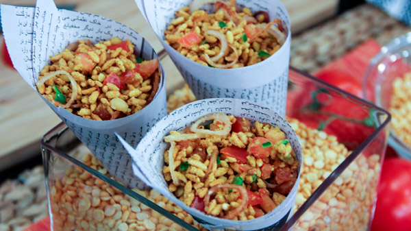 Jhaal Muri served in the paper fold in the form of a cone.