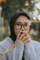 woman wearing eyeglasses and black hijab