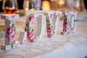 white and pink floral freestanding letter decor