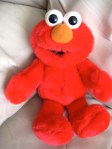 Hug him and Elmo tells you: "Hugs and kisses" ~ "Elmo loves you!" and he makes kissing sounds!