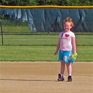 Grace's great-great-granddaughter at age 6, learning to play softball. But she loves to draw, too.