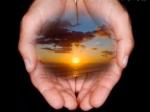 Sunset over Ocean in Hands