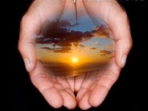 Sunset over Ocean in Hands