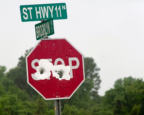 joe_1180 One more in our continuing coverage of well ventilated stop signs in southern Arkansas. This one was smacked with a couple of big bore shots.