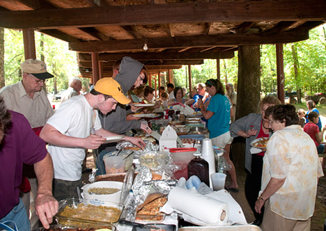 JOE_3610 What you see here is southern potluck at it's finest. And you are seeing just a fraction of it. There are five more tables just like this one, brimming with mouthwatering cuisine from home kitchens. It's chow-time at the 133rd Marks-Barnett Family Reunion in Cleveland County, Arkansas.