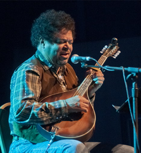 Harrison Kennedy playing mandolin at the Blues Music Awards