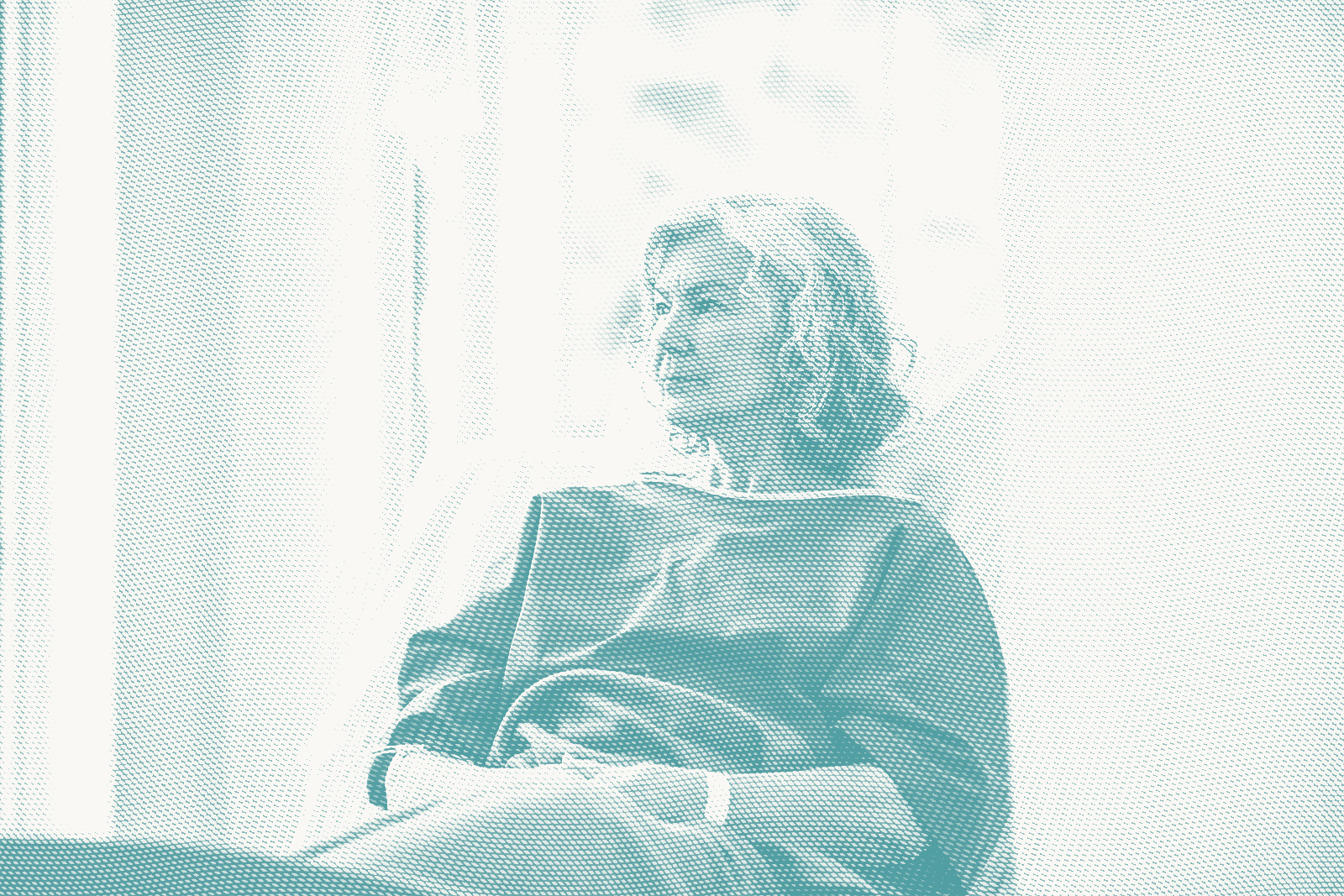 an older woman wearing a hospital gown waits for a lumpectomy