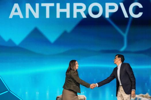 Anthropic_42919-1 Anthropic co-founder and President Daniela Amodei, left, shakes hands with Snowflake CEO Sridhar Ramaswamy during the keynote presentaton at Snowflake Summit 26 Monday, June 1, 2026, in San Francisco. (AP Photo/Jeff Chiu)