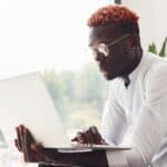 young man works on a laptop