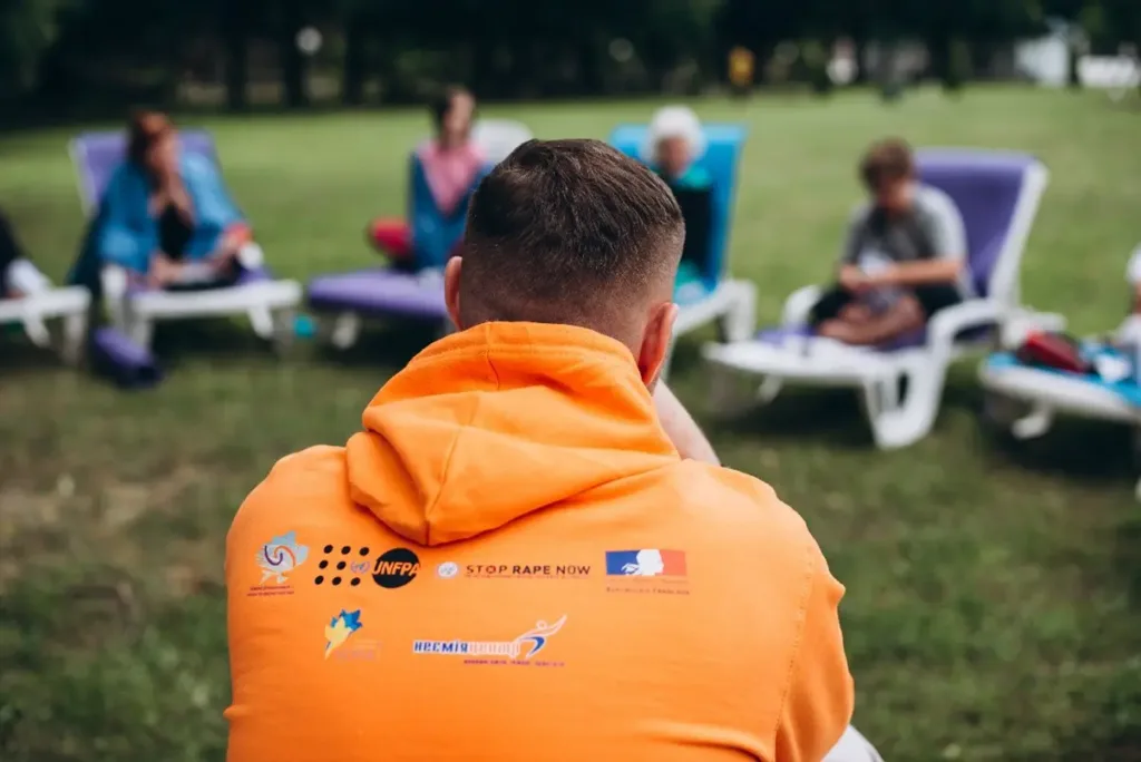 A UN Action worker wearing a Stop Rape Now branded hoodie.