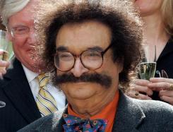 Obit_Gene_Shalit_79482 FILE – In this May 31, 2006 file photo, film critic Gene Shalit is seen during a toast with “Today” show cast and crew at the end of Katie Couric’s final show, in New York. (AP Photo/Richard Drew, File)