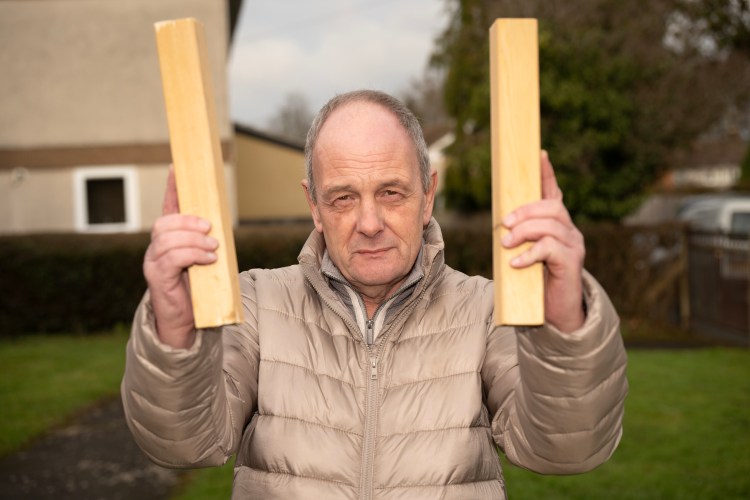 Councillor David Henwood holding Hyōshigi sticks.