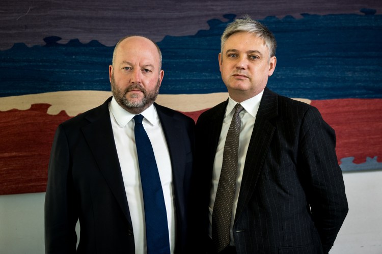 Nick Timothy MP (L) and Lord Walney (R) during an interview with The Times at Portcullis House, Westminster in London.