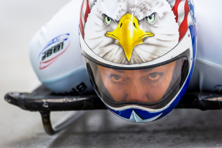 US' Katie Uhlaender competes in the women's skeleton competition, wearing a helmet painted with an American flag and bald eagle.