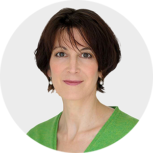 a woman with short brown hair is wearing a green shirt