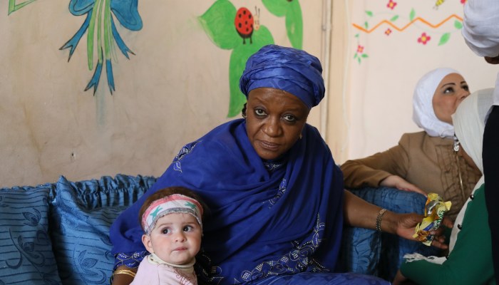 20150420 SRSG with child - Charity visit Hussam Al Saleh