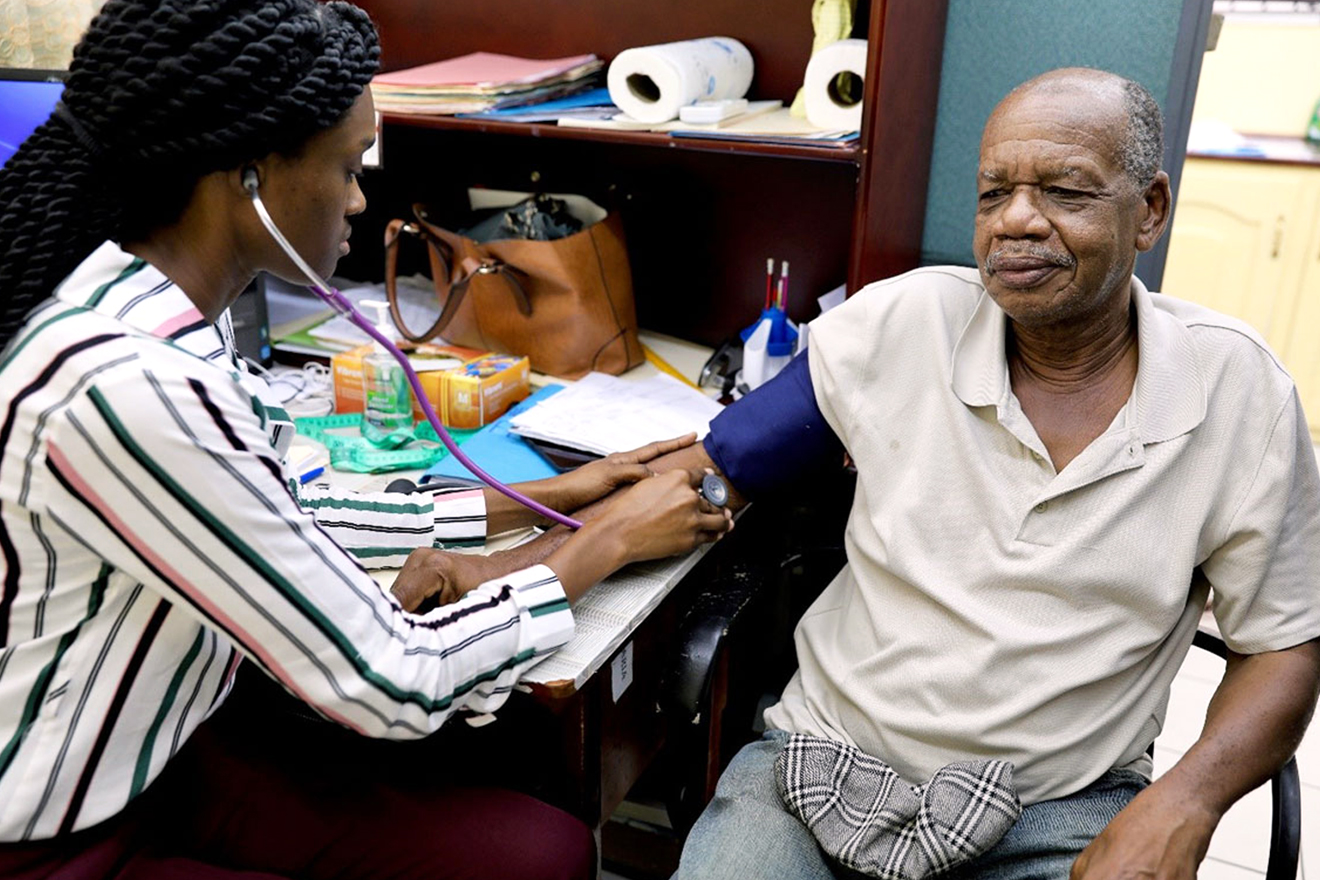 Monty-Gaskin is a qualified dance referee in Guyana and has been a patient at the clinic for just a couple of years. Monty-Gaskin has his blood pressure examined by a health practitioner in a hospital setting.