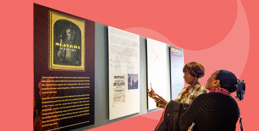 Two women look at posters