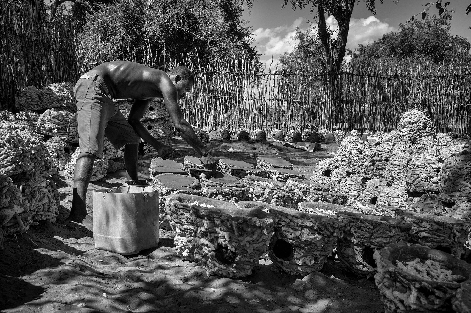 A man building octopus habitat