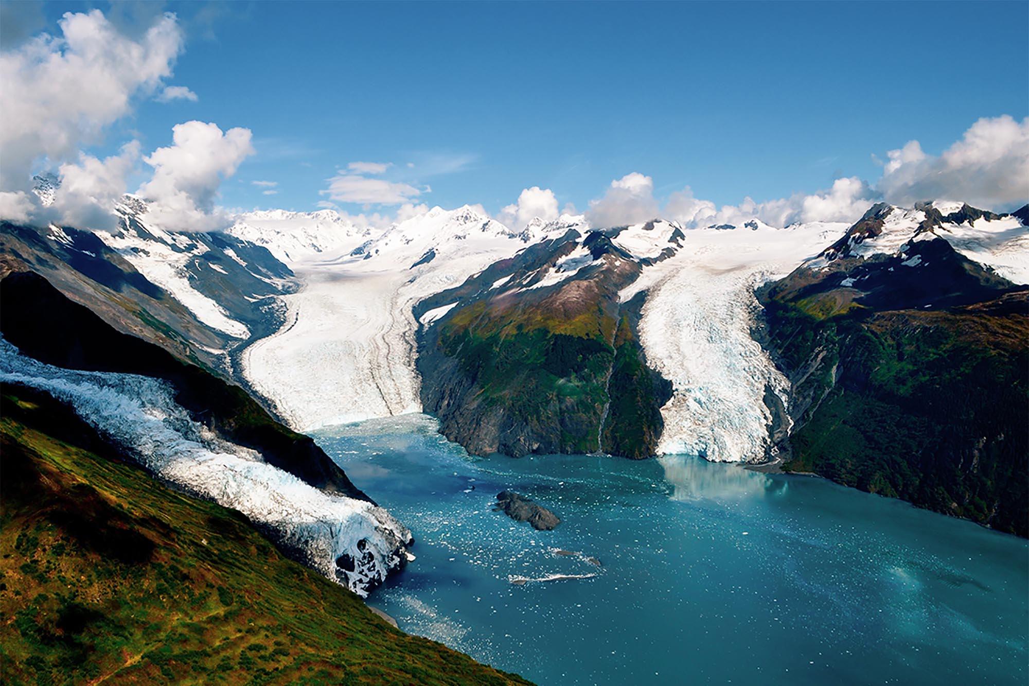 Glaciers calving into blue waters