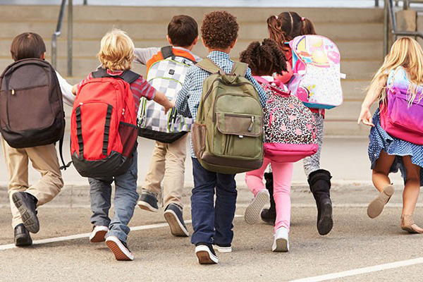 New guidelines provide roadmap for safe reopening of schools children running towards staircase