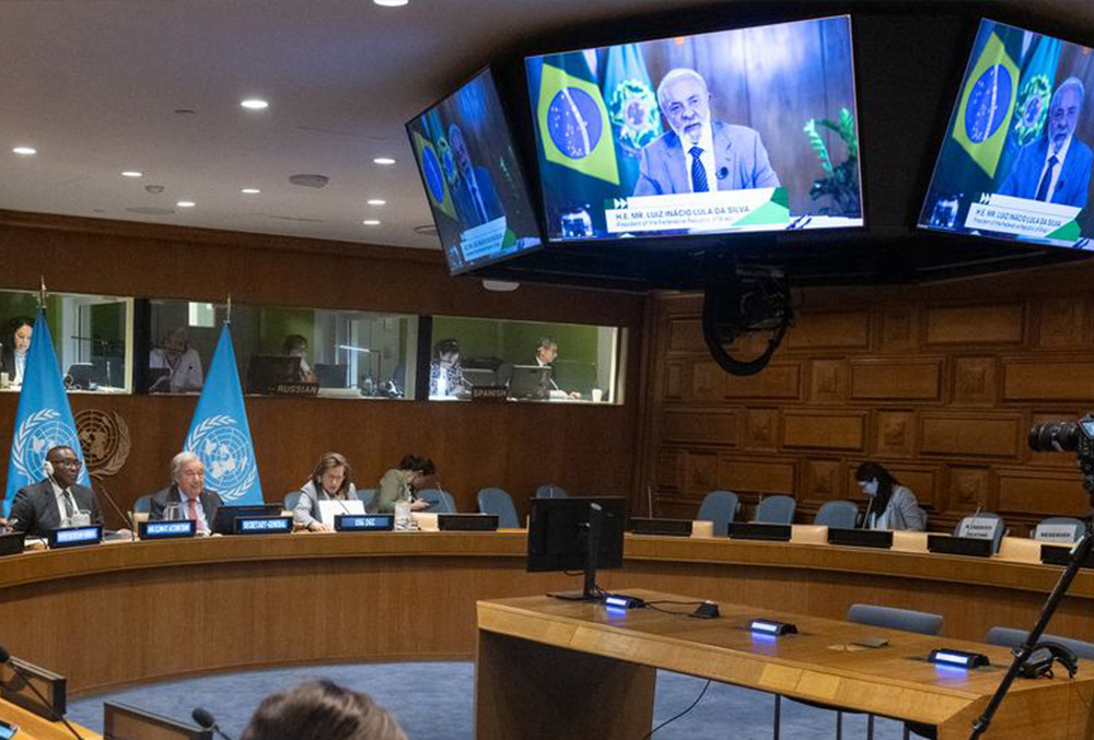 SG speaking at a conference table