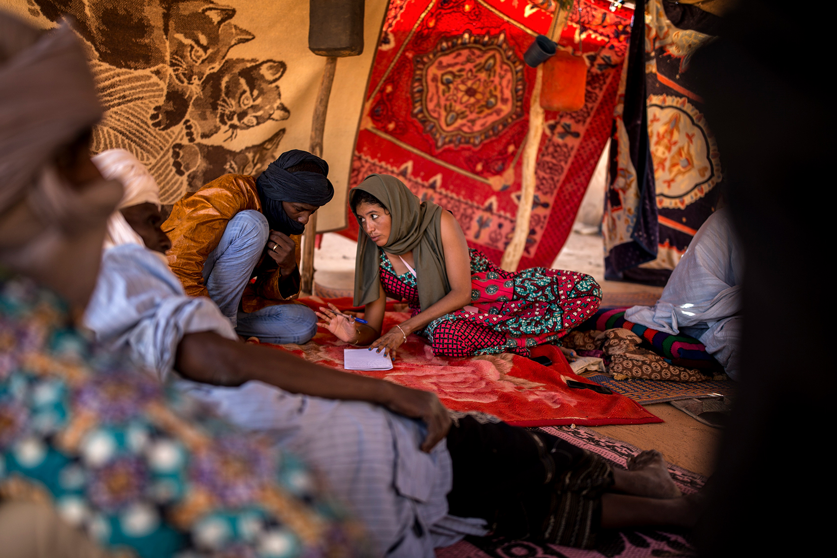 A woman talking to a man