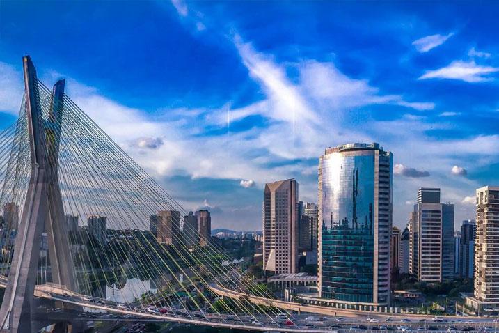 arial view of an urban city with a bridge