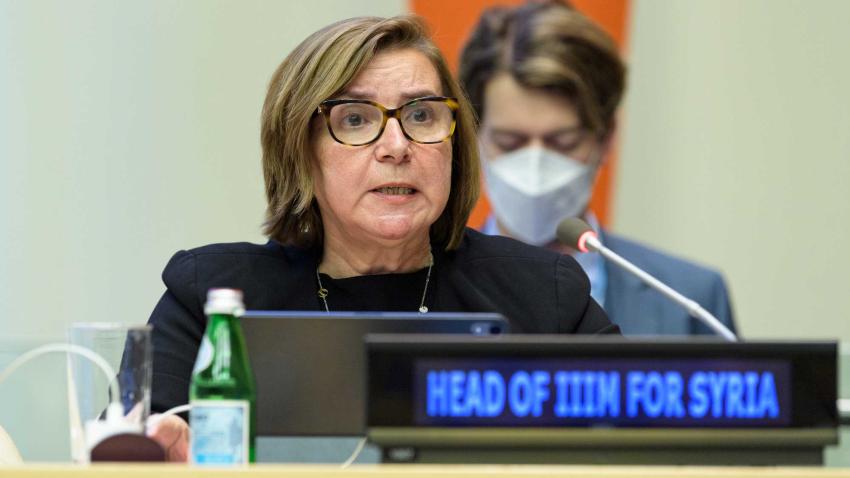 Catherine Marchi-Uhel speaks to a microphone in the Security Council Chamber