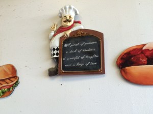 Words of wisdom attached to a wall at Randazzo's Pizzeria.